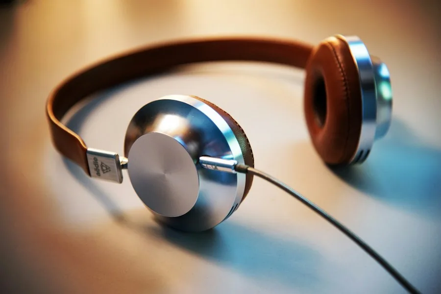 Silver headphones resting on a table (illustrative stock photo)