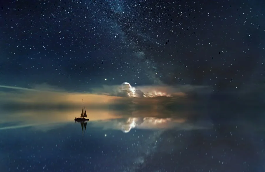 Starry sky over calm water at night (illustrative stock photo)