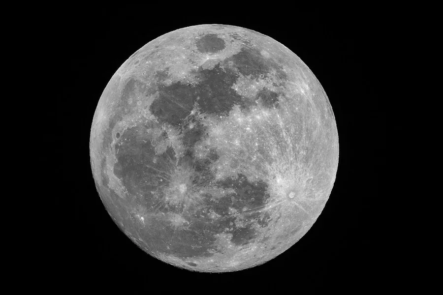 Full moon against a black night sky (illustrative stock photo)