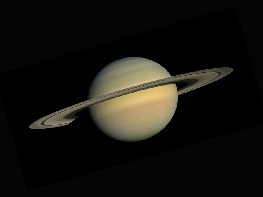 The planet Saturn and its rings against black space (illustrative stock photo)